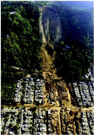 As a 7.6-magnitude earthquake rocked El Salvador in January 2001, this hillside above a suburban neighborhood gave way. The landslide buried hundreds of homes and accounted for over half of the nearly 700 earthquake victims.