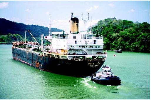 Tanker carriers are a major mode of export for petroleum resources. This tanker is assisted by a tugboat in the Panama Canal.