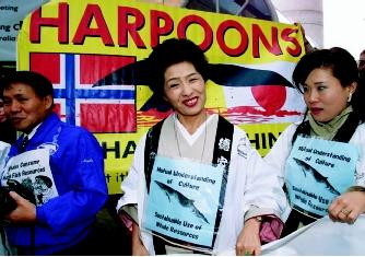 The concept of sustainable development applies not only to water itself, but also to the living resources it supports. Shown here are Japanese supporters of commercial whaling standing in front of an anti-whaling banner at an annual meeting of the International Whaling Commission.