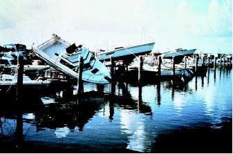 Large waves generated by hurricanes and other natural events can wreak havoc along the coast and cause flooding far from shore. Despite the sometimes spectacular damage caused along the coast, inland flooding causes approximately half of the hurricane-related deaths in the United States. These boats in a marina were tossed about by Hurricane Andrew in 1992, whose storm surge inundated areas from the northwestern Bahamas, through the southern Florida peninsula, up to the coast of Louisiana.